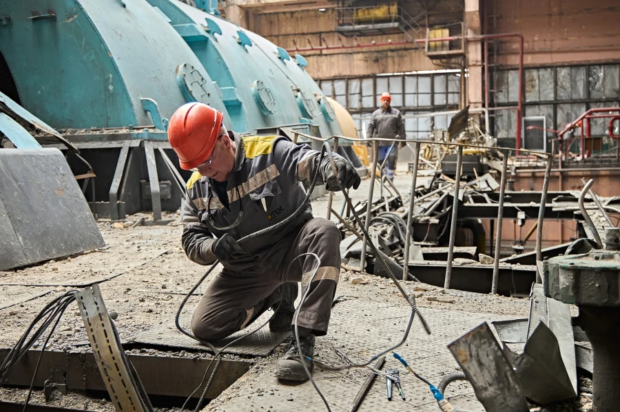 DTEK power engineer works to restore DTEK's thermal power plant after russian attack