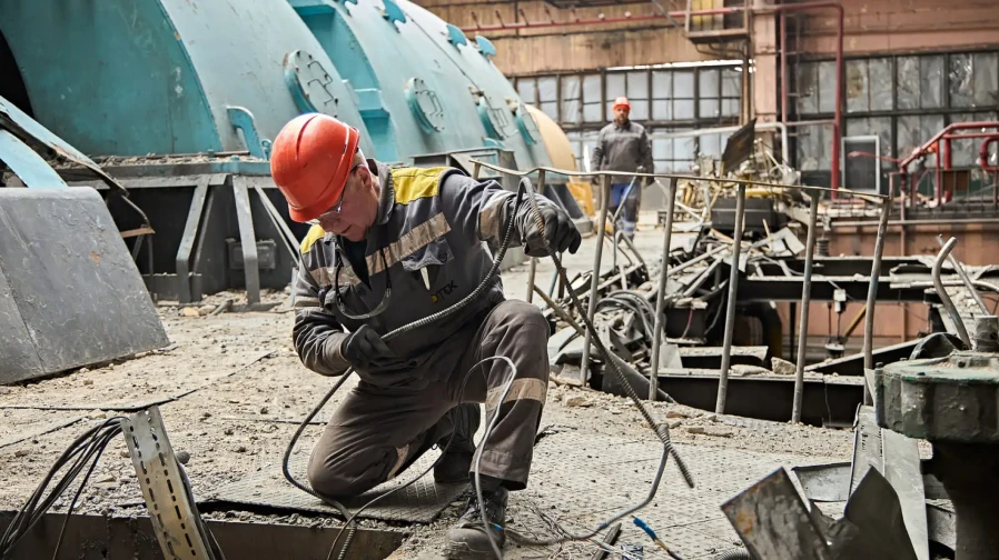 DTEK power engineer works to restore DTEK's thermal power plant after russian attack