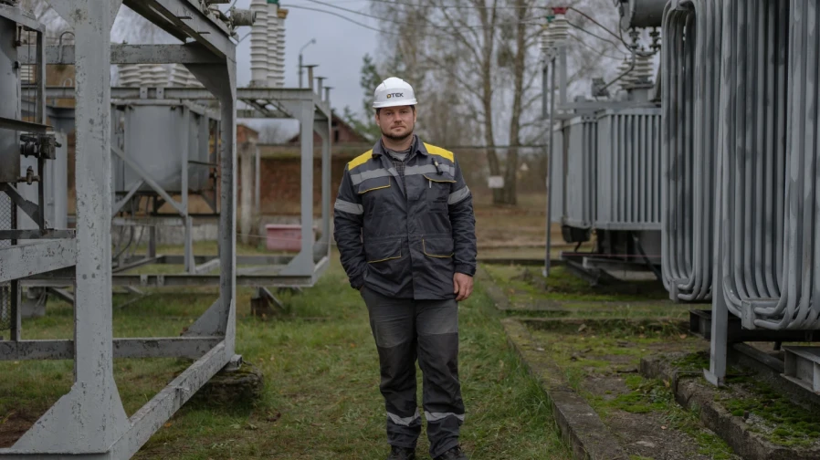 Oleksandr Adamchuk, 36, a repair and maintenance supervisor for substations, poses for a portrait while performing scheduled repair work on an energy substation, Friday, Oct. 24, 2025, in Kyiv region, Ukraine. “The main